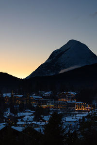 Scenic view of snowcapped mountains against clear sky during winter