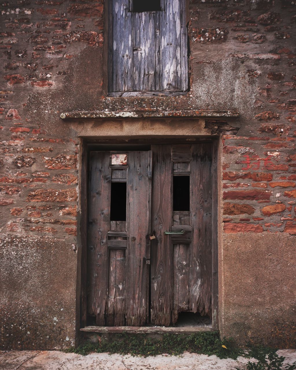 CLOSED DOOR OF OLD HOUSE