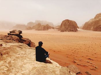 Rear view of man looking at mountain