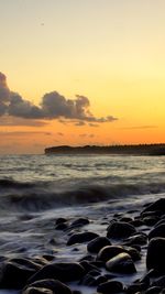 Scenic view of sea at sunset