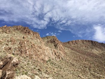 Low angle view of rock formations against sky