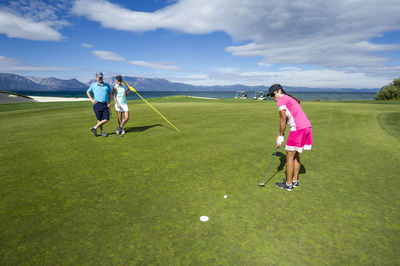 Friends playing golf at edgewood tahoe in stateline, nevada.