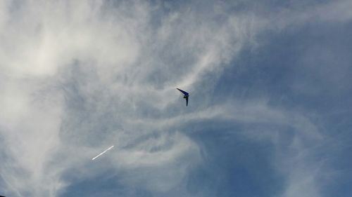 Low angle view of airplane flying in sky