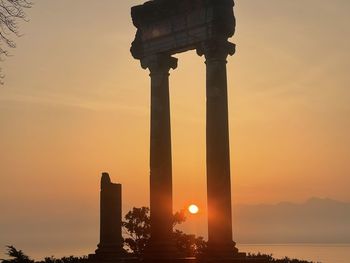 Silhouette of historical building during sunset