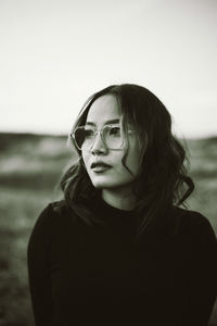 Portrait of young woman wearing sunglasses 