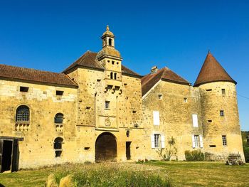 Historic building against clear blue sky