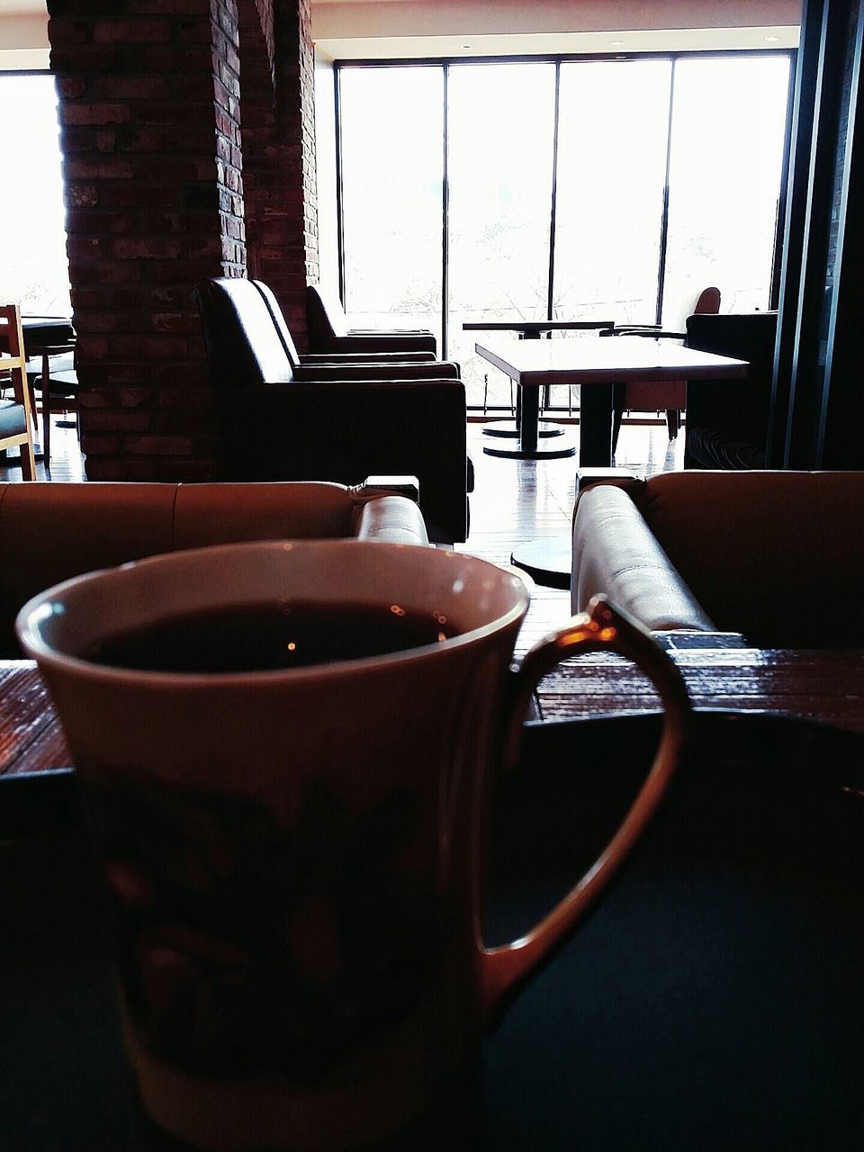 drink, coffee cup, table, refreshment, coffee - drink, food and drink, indoors, coffee, saucer, still life, cup, close-up, chair, frothy drink, cafe, freshness, no people, tea cup, tea, beverage