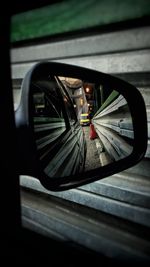 Reflection of car on side-view mirror