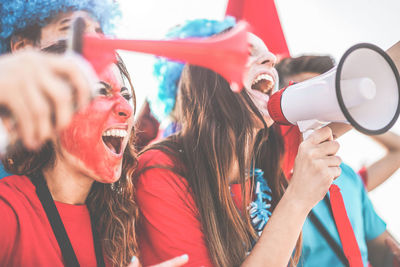 Happy soccer fans cheering