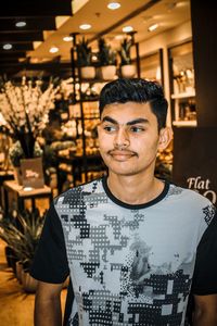 Portrait of smiling young man standing outdoors