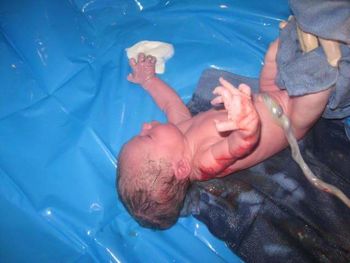 High angle view of man lying in swimming pool