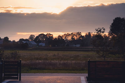 Scenic view of landscape against sky at sunset