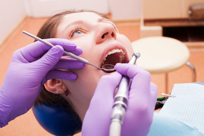 Woman doing dental check up at clinic