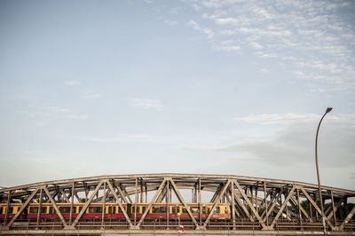 Low angle view of ferris wheel against sky