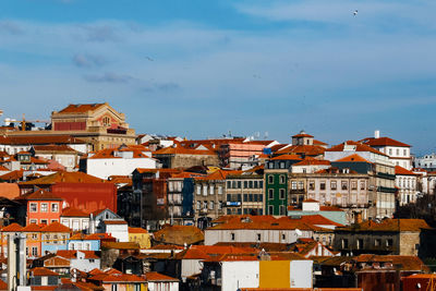 Buildings in city against sky