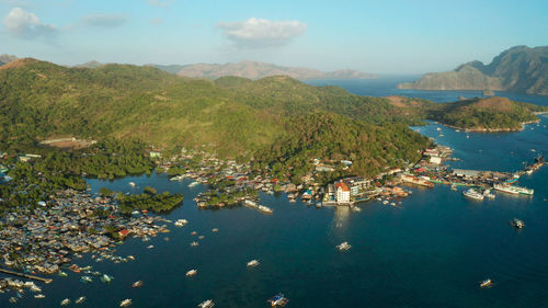 Aerial view coron city with slums and poor district. sea port, pier, cityscape coron town with boats