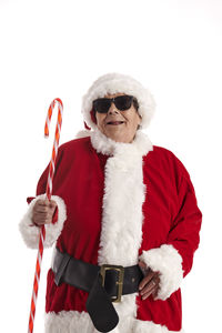 Portrait of man wearing sunglasses against white background