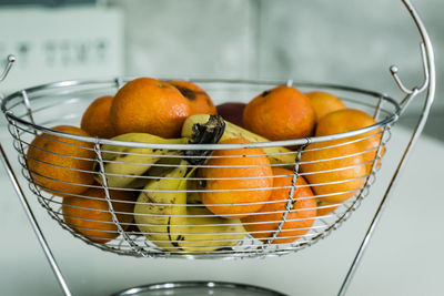 Close-up of orange fruits in basket