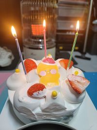 Cropped hand of woman holding cake