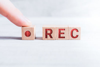 Midsection of person holding text against white background