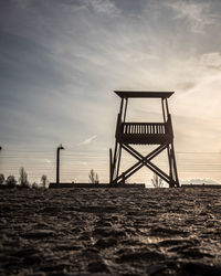 Lifeguard hut on beach against sky