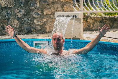 Portrait of man in swimming pool