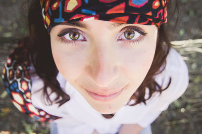 Close-up portrait of woman sitting outdoors