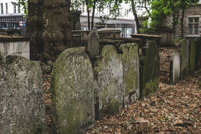 Panoramic view of cemetery against building