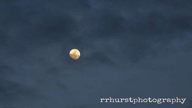 low angle view, moon, sky, night, full moon, beauty in nature, astronomy, cloud - sky, nature, scenics, tranquility, cloudy, planetary moon, circle, tranquil scene, sphere, outdoors, dusk, space exploration, no people