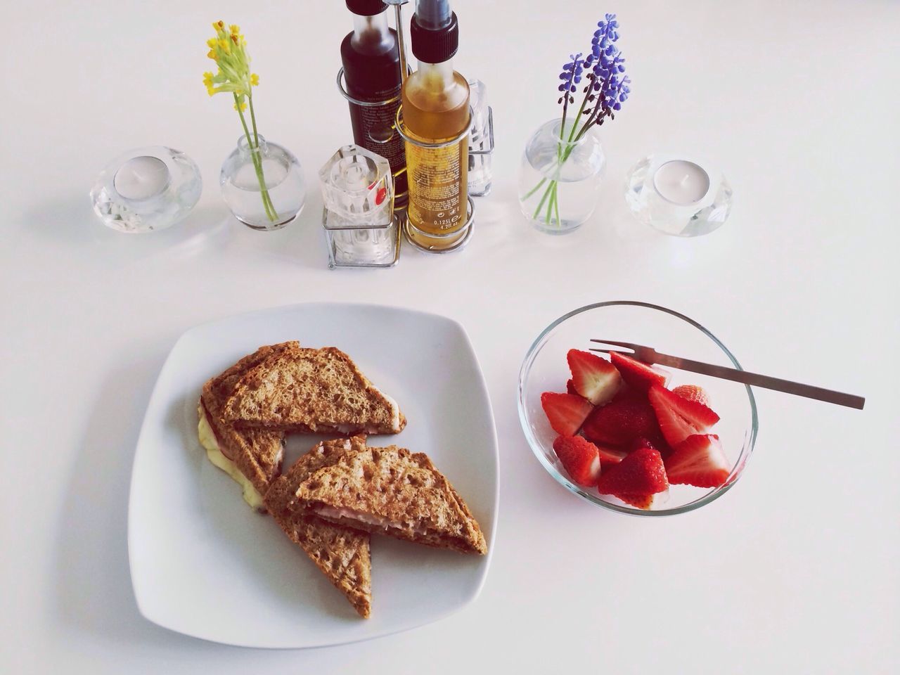 food and drink, food, freshness, indoors, still life, table, plate, ready-to-eat, healthy eating, high angle view, indulgence, fruit, serving size, drink, strawberry, drinking glass, sweet food, red, slice, close-up