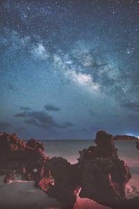 Scenic view of sea against sky at night