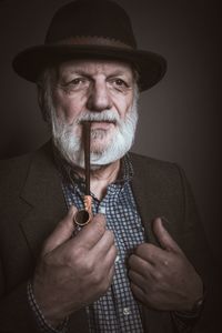 Midsection of man holding light bulb