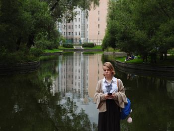 Portrait of smiling woman in lake