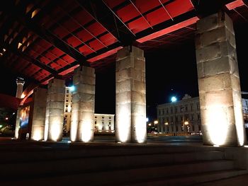 Illuminated city against sky at night