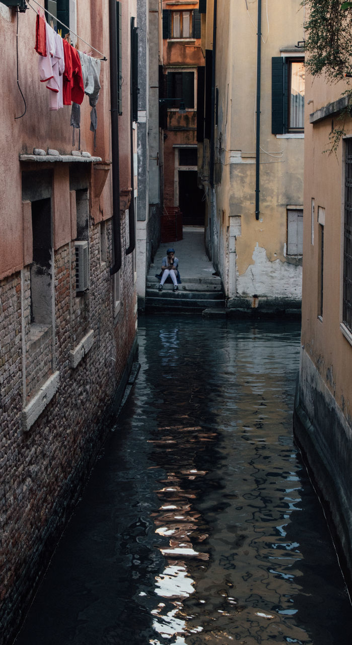 VIEW OF CANAL AMIDST BUILDINGS