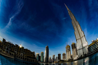 Modern buildings in city against sky