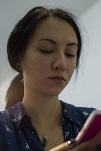 Low angle view of woman using smart phone