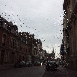 View of city street seen through wet window