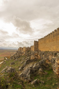 View of castle against cloudy sky