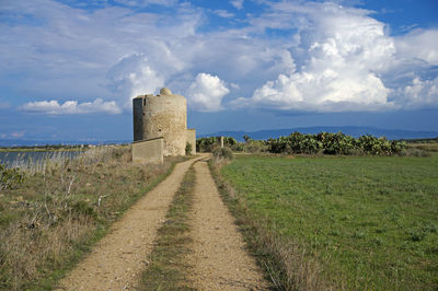 Panoramic view of castle on field against sky