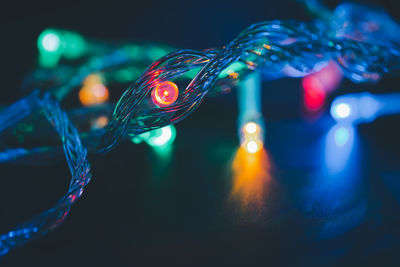 Close-up of illuminated christmas lights at night