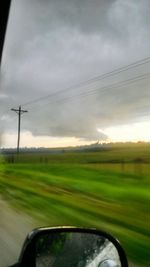 View of landscape against cloudy sky