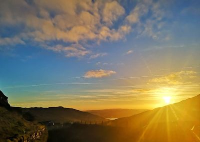 Scenic view of mountains against sky during sunset