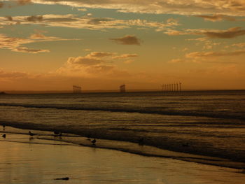 Scenic view of calm sea at sunset