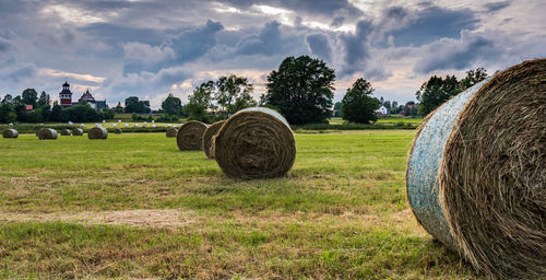 Sunset over the swedish landscape with rolled grass in the fields