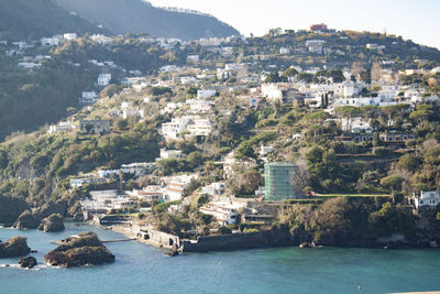 Aerial view of townscape by sea