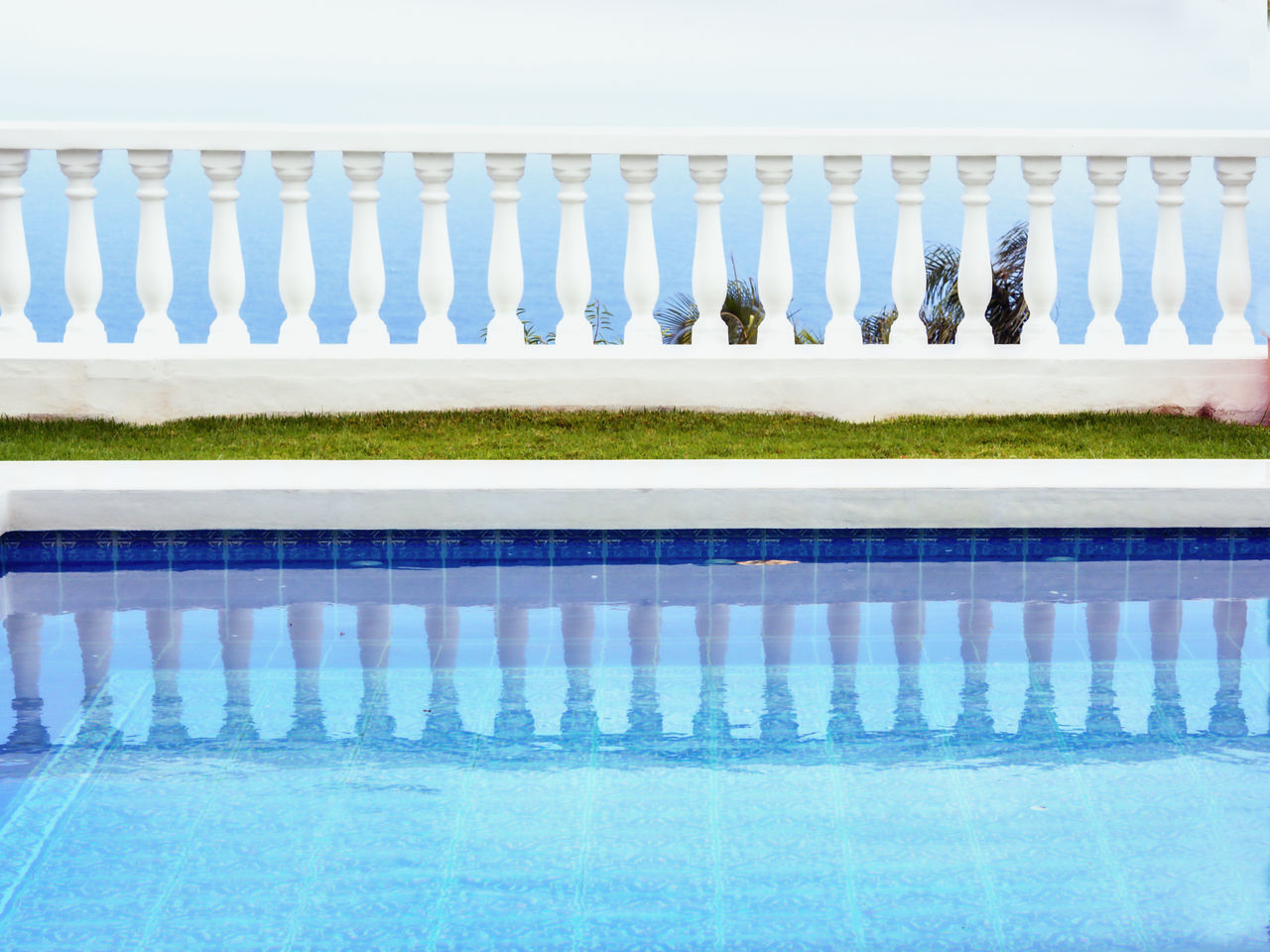 VIEW OF SWIMMING POOL AGAINST WINDOW