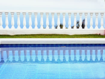 View of swimming pool by window