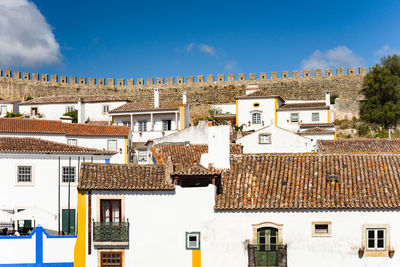 House against fortified wall at obidos