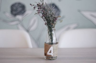 Close-up of flower vase on table